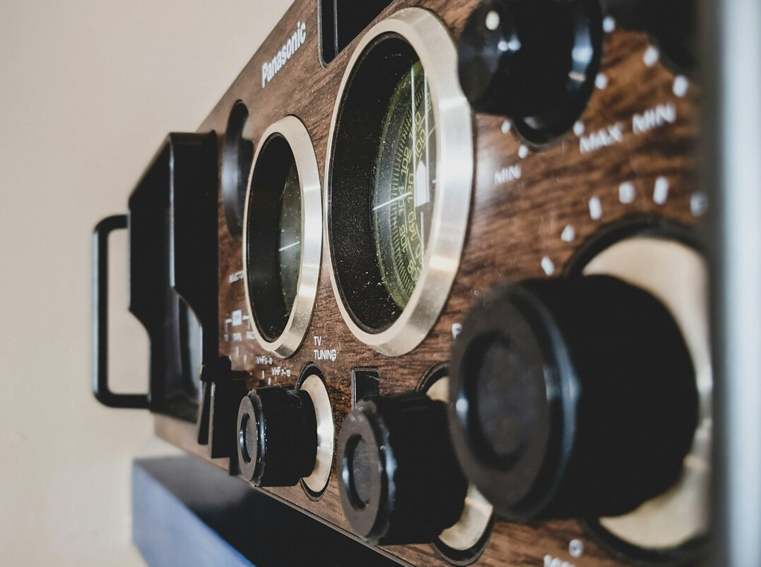 Close-up of vintage broadcast equipment with analog dials